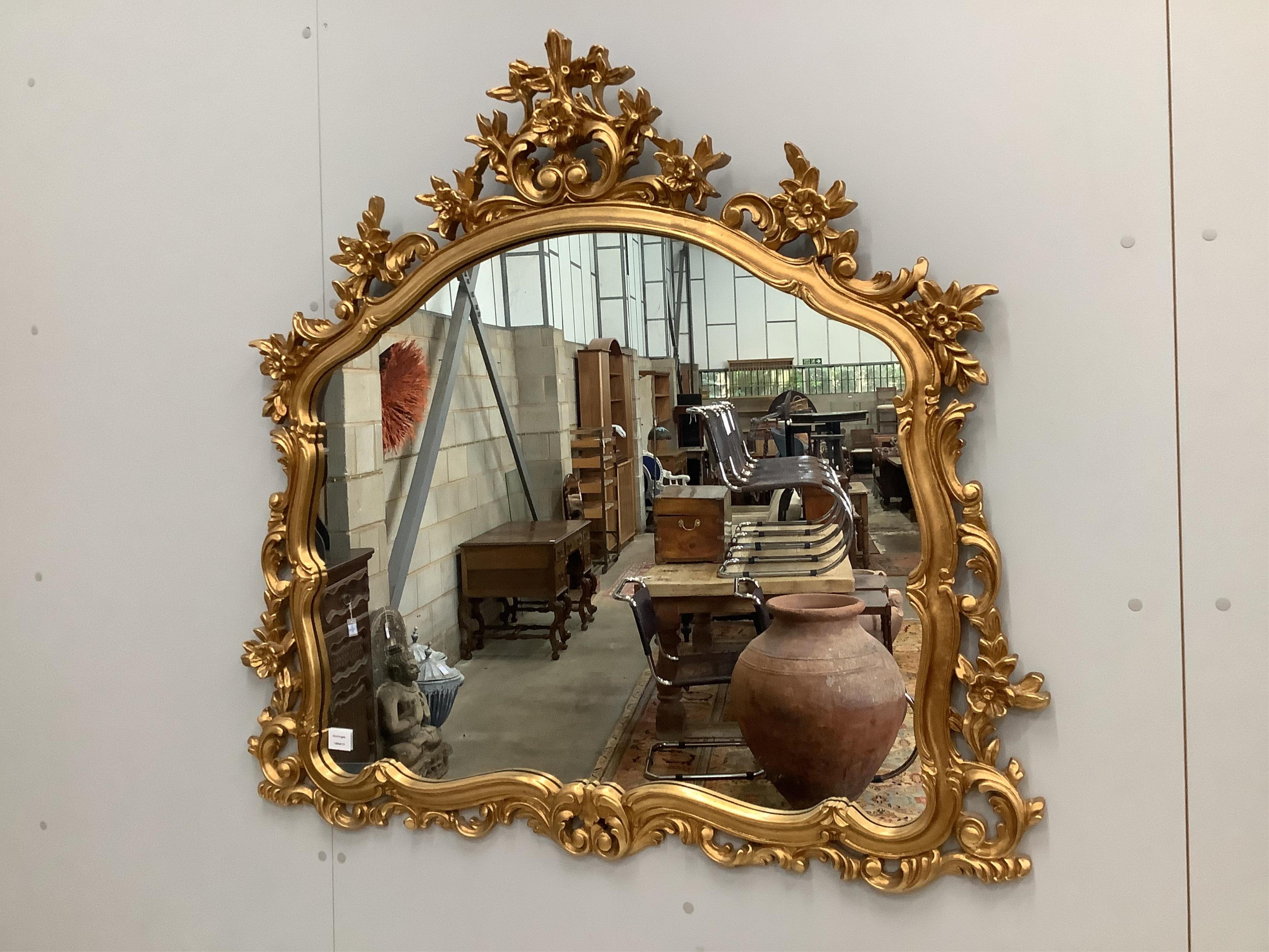 A Victorian style composition gilt framed wall mirror, width 120cm. Condition good